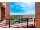 An outdoor balcony featuring brick pillars and a grand view of the neighborhood at 8100 E Union Ave # 1502, Denver, CO 80237