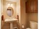 Well-lit powder room featuring a pedestal sink and traditional fixtures and decor at 8100 E Union Ave # 1502, Denver, CO 80237