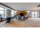 Resident lounge features a seating area and built in media center with access to the outside at 8100 E Union Ave # 1502, Denver, CO 80237