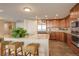 Spacious kitchen with stainless steel appliances, a center island, and beautiful tile floors at 8100 E Union Ave # 1502, Denver, CO 80237