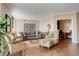 The living room features hardwood floors, neutral walls, and access to the office at 8100 E Union Ave # 1502, Denver, CO 80237