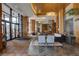 Grand lobby entrance with wood details, open layout and access to reception and sitting areas at 8100 E Union Ave # 1502, Denver, CO 80237