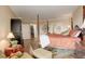 Main bedroom features a walk-in closet, sitting area, hardwood floors, and refined decor at 8100 E Union Ave # 1502, Denver, CO 80237