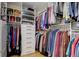 Organized walk-in closet features custom shelving, drawers, and ample storage space at 8100 E Union Ave # 1502, Denver, CO 80237