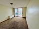 Inviting room showcasing neutral carpet and balcony access, perfect for relaxation at 1155 N Ash St # 908, Denver, CO 80220