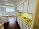 Bright kitchen with white cabinets, stone countertops, and modern appliances at 1155 N Ash St # 908, Denver, CO 80220