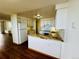 Modern kitchen featuring white cabinetry, stainless steel appliances, and attractive stone countertops at 1155 N Ash St # 908, Denver, CO 80220