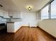Bright kitchen with white cabinets, stone countertops, and stainless steel appliances at 1155 N Ash St # 908, Denver, CO 80220