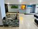 Inviting lobby featuring tiled floors, a rock garden with planters, and a reception desk at 1155 N Ash St # 908, Denver, CO 80220