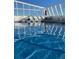 Indoor swimming pool featuring glass walls and ceilings, with lounge chairs and tables at 1155 N Ash St # 908, Denver, CO 80220