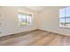 Bright bedroom with laminate floors and large windows that let in plenty of natural light at 10720 Snowdon St, Parker, CO 80134