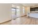 Bright kitchen featuring a kitchen island, stainless appliances, and a sliding door to a large patio at 10720 Snowdon St, Parker, CO 80134