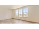 Bright living room featuring hard wood floors, recessed lighting, and large windows with scenic views at 10720 Snowdon St, Parker, CO 80134