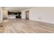 Open concept living area with modern wood floors, recessed lighting, and an open flow to the kitchen at 10720 Snowdon St, Parker, CO 80134