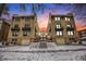 Apartment building at dusk, showcasing facade, balconies, and landscaped grounds at 960 N Sherman St # 2G, Denver, CO 80203