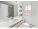 Clean bathroom with updated vanity, sink, toilet, shower and natural light at 960 N Sherman St # 2G, Denver, CO 80203