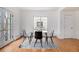Bright dining area features hardwood floors, a window and a modern table with chairs at 960 N Sherman St # 2G, Denver, CO 80203