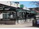 Outdoor patio with green awnings and green walls for Govnr's Park Restaurant & Tavern at 960 N Sherman St # 2G, Denver, CO 80203