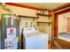 Functional laundry area with modern appliances and ample storage, adding convenience to daily chores at 10893 Milliken Ave, Conifer, CO 80433
