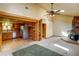 Inviting living space featuring an open floor plan with a stone fireplace and an updated kitchen at 10893 Milliken Ave, Conifer, CO 80433
