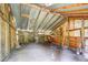 Interior of a shed featuring a dirt floor and partially exposed framework at 10893 Milliken Ave, Conifer, CO 80433