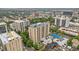 High-angle aerial shot of residential building with tennis court and landscaped surroundings at 800 N Pearl St # 1109, Denver, CO 80203