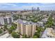 An aerial view showcases the apartment building and surrounding city skyline at 800 N Pearl St # 1109, Denver, CO 80203