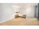 Neutral bedroom featuring a single bed, side table with lamp, and soft carpet flooring at 800 N Pearl St # 1109, Denver, CO 80203