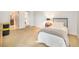 Bright bedroom featuring a single bed, soft carpet flooring, mirrored closet, and an open bathroom at 800 N Pearl St # 1109, Denver, CO 80203