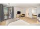 Bright bedroom features a sliding patio door and mirrored closet, soft carpet flooring, and flat screen TV at 800 N Pearl St # 1109, Denver, CO 80203