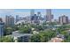 Expansive daytime view of the Denver skyline featuring modern high-rise buildings and lush greenery at 800 N Pearl St # 1109, Denver, CO 80203