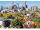 Sweeping view of the Denver skyline in the autumn with colorful trees at 800 N Pearl St # 1109, Denver, CO 80203