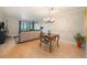 Bright dining area with hardwood floors, city views, and an elegant chandelier at 800 N Pearl St # 1109, Denver, CO 80203