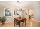Dining area with view to the kitchen and bathroom at 800 N Pearl St # 1109, Denver, CO 80203