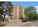 Multi-story building with brick facade, mature trees, and well-maintained landscaping at 800 N Pearl St # 1109, Denver, CO 80203
