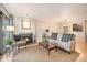Comfortable living room features a cozy fireplace, a balcony, and stylish furnishings at 800 N Pearl St # 1109, Denver, CO 80203