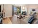 Inviting living room with a fireplace, balcony access, and comfortable seating at 800 N Pearl St # 1109, Denver, CO 80203