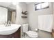 Basement bathroom with toilet, sink, and shower at 12482 W Mississippi Ave, Lakewood, CO 80228