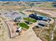 An aerial view of a community area with a pool, clubhouse, home, and community garden at 39743 Penn Rd, Elizabeth, CO 80107