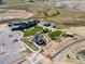 Aerial view of a community area with a pool, clubhouse, home, and community garden at 39743 Penn Rd, Elizabeth, CO 80107