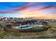 Community pool, clubhouse, and garden in an aerial view at 39743 Penn Rd, Elizabeth, CO 80107