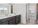 Bathroom featuring double vanity, granite countertops, tile floor, and a walk-in shower at 39743 Penn Rd, Elizabeth, CO 80107
