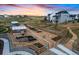 Raised garden beds and a green house create this community garden at sunset at 39743 Penn Rd, Elizabeth, CO 80107
