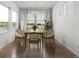 Bright dining room with a modern chandelier, large windows, and stylish green dining chairs at 39743 Penn Rd, Elizabeth, CO 80107