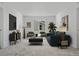 Open-concept living room with large windows, plush seating, and modern furnishings at 39743 Penn Rd, Elizabeth, CO 80107