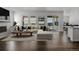 Open-plan living area boasts a neutral color scheme, lots of natural light, and seamless indoor-outdoor transition at 39743 Penn Rd, Elizabeth, CO 80107