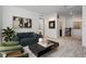 Inviting living room featuring plush sofa, modern coffee table, and an adjoining staircase at 39743 Penn Rd, Elizabeth, CO 80107