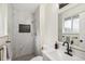 Updated bathroom featuring tiled shower, modern fixtures, and stylish design at 8622 W Warren Ln, Lakewood, CO 80227