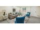 Cozy finished basement living room with recessed lights, neutral colors, stylish décor, and comfortable seating at 8622 W Warren Ln, Lakewood, CO 80227