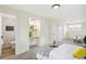 Bright bedroom with walk-in closet and updated bathroom, with a small workstation at 8622 W Warren Ln, Lakewood, CO 80227